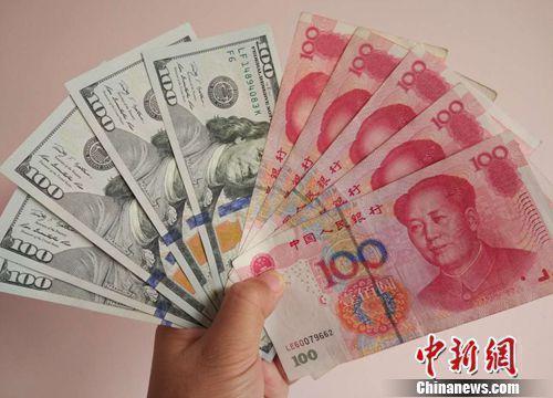 人民幣和美元資料圖。<a target='_blank' href='/' >中新網(wǎng)</a>記者 李金磊 攝